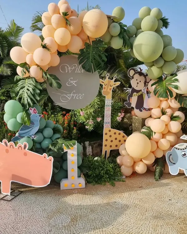 We are so happy that big birthday bashes for little kids are back. We love creating fun themes like this "Wild & Free" setup, complete with adorable animal cutouts and balloon arrangements.