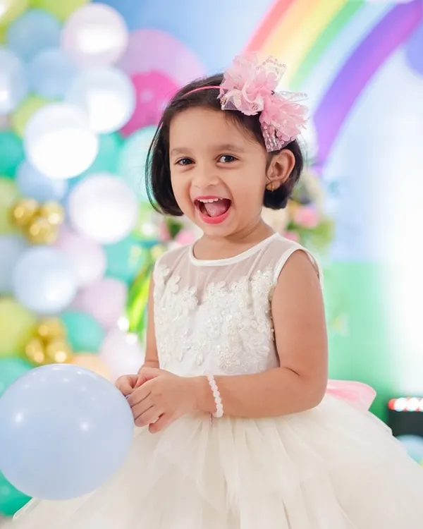Pure joy in a dress made for a princess. This angelic white frock features a beautifully detailed lace bodice and a multi-layered tulle skirt, making it a perfect choice for birthdays, celebrations, and flower girl duties.