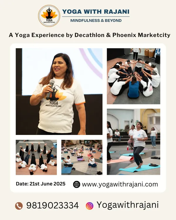 A snapshot of a vibrant yoga event hosted in partnership with Decathlon and Phoenix Marketcity, showcasing a mix of on-stage instruction and group participation.