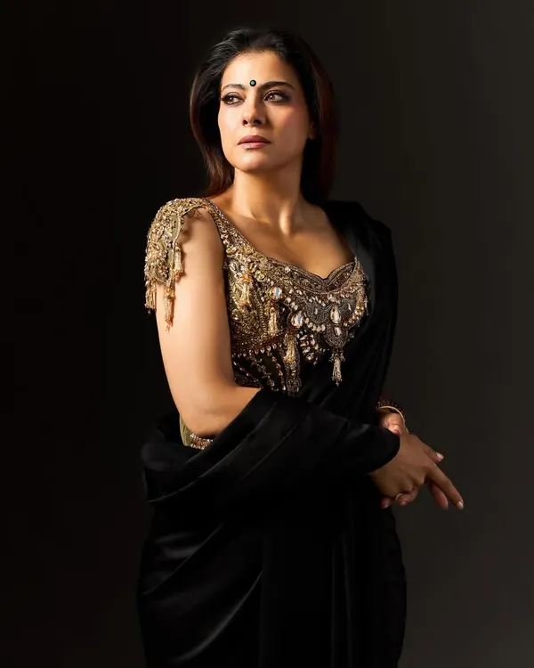 A close-up of Kajol's 'Kali' inspired look, focusing on the incredibly detailed gold corset blouse that serves as modern armor.
