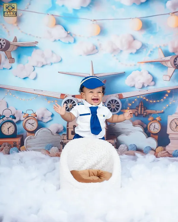 Our little pilot is flying high on happiness! This aviation theme, complete with clouds and vintage planes, is perfect for adventurous babies.