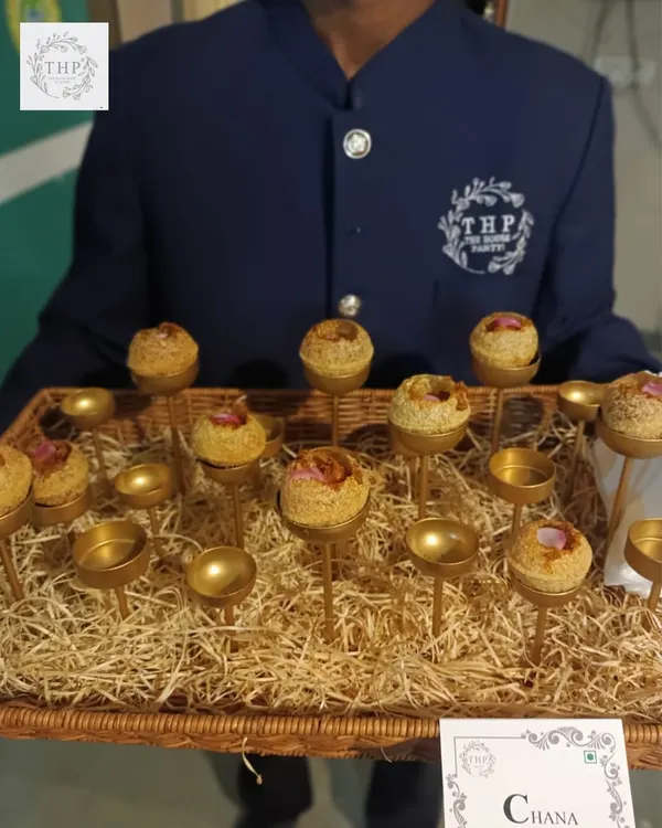 This is how we elevate even the simplest dishes. Our Chana starter is served individually on golden stands by our professional staff, giving your guests a unique and memorable bite. It's this attention to detail that we bring to every wedding event.
