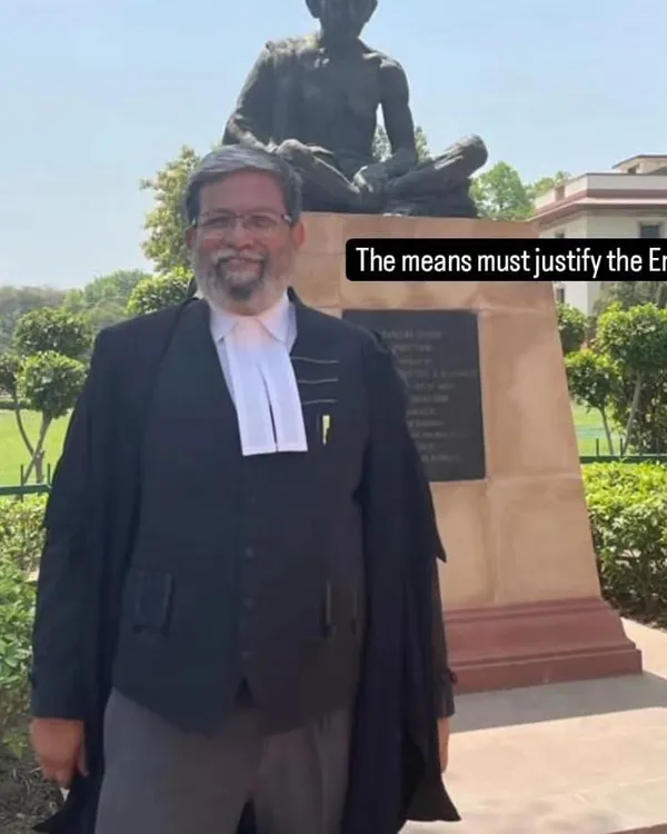 Standing before the statue of Mahatma Gandhi, a reminder that in law, as in life, the means must always justify the end. This is the core of my ethical approach to criminal defense.