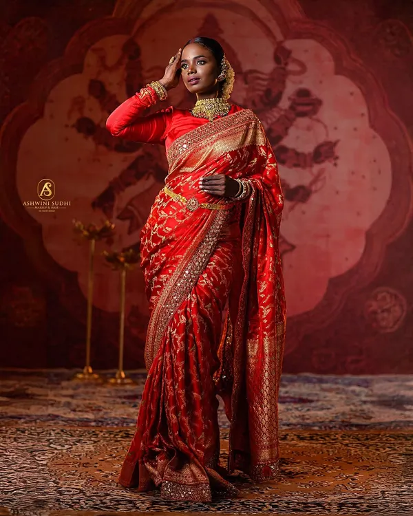 This shot captures the grandeur we can achieve for traditional and bridal portraits. The hand-painted backdrop, combined with precise cinematic lighting, creates a regal atmosphere perfect for showcasing ethnic wear.