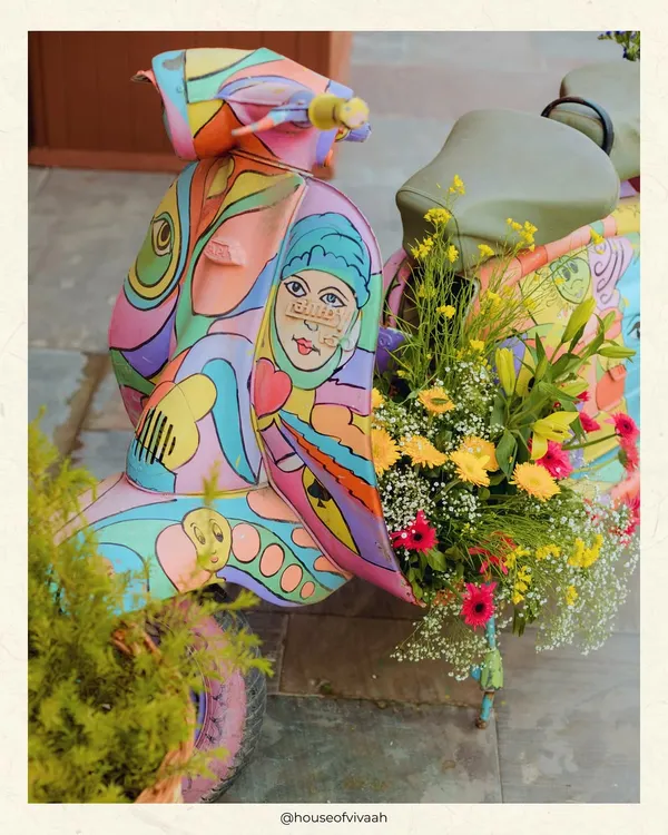 A hand-painted Vespa scooter, overflowing with flowers, captures the playful spirit of a Positano summer. This was a key photo-op at a Mehendi, designed to be a joyful and artistic expression of the theme.
