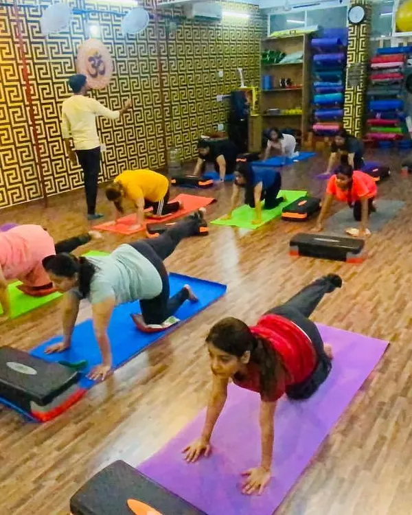 Full house for our morning aerobics class! We use steppers and bodyweight exercises to get your heart pumping and build stamina. It's high energy and lots of fun.