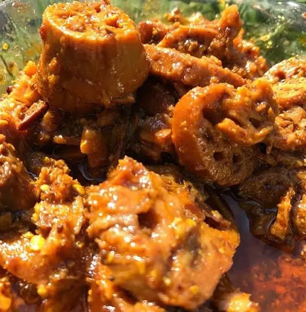 A close-up of my Lotus Stem (Bhen) pickle. The unique, lace-like pattern of the lotus stem makes this pickle as beautiful as it is delicious, with a satisfying crunch.