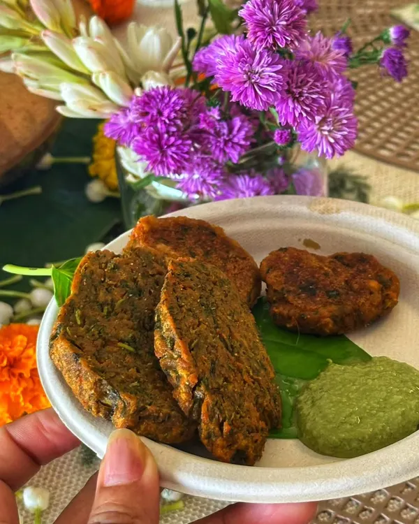 Kothimbir Wadi, a classic Maharashtrian snack that I make every day. We roll it, steam it, slice it, and then fry it to perfection. It's crispy, herby, and absolutely delicious, especially with a spicy chutney.