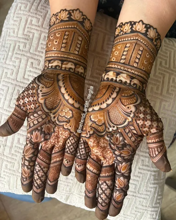 An intricate design featuring a band of elephants, symbolizing strength and good fortune, combined with classic floral and geometric patterns.