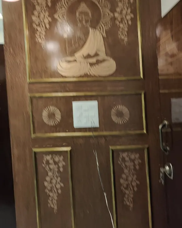 This main door, featuring a beautiful Buddha carving, was carefully polished to enhance its detailed craftsmanship. A quality wood finish not only looks great but also protects the delicate carvings from the elements.