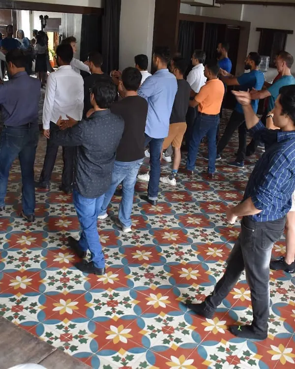 A combined class at the India Tango Festival, with all the teachers leading the group. This is a unique opportunity for students to learn from multiple experts in one session.