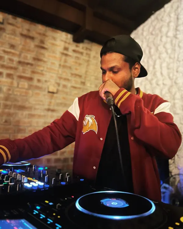 Grabbing the mic at Watson's. I'm not afraid to step up and be the master of ceremonies, guiding the energy of the party throughout the night.