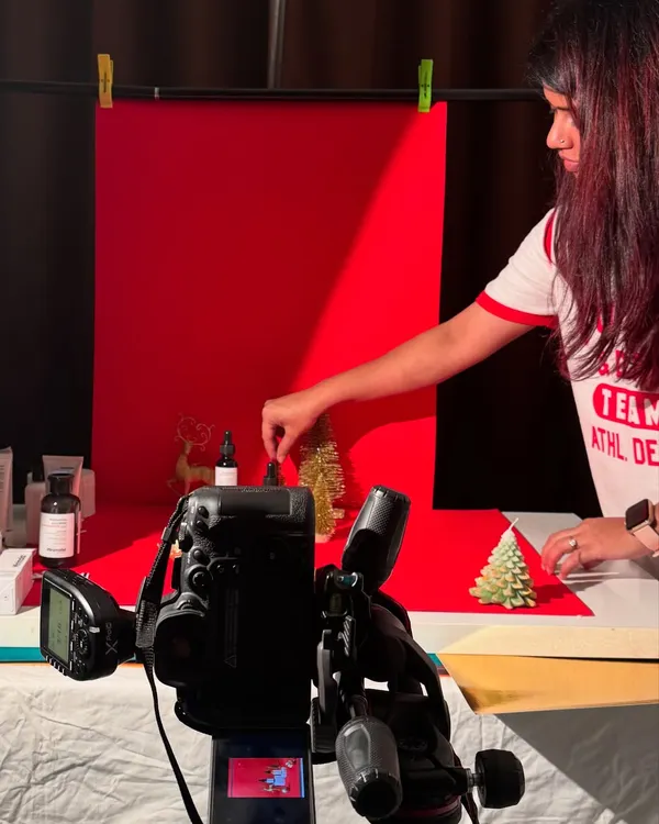 Reunited with a dear friend and collaborator on set. This is us, in our element, setting up for a Christmas-themed product shoot. It's all about getting the small details right.