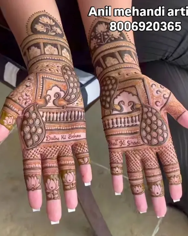 This is a great example of my intricate work for the groom's sister, featuring peacock motifs, lotus details on the fingers, and personalized text reading "Dulhe Ki Behen" and "Bhai Ki Shadi".