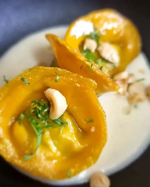 Our artisanal, handmade butternut squash and truffle ravioli. We received a message from a client saying we "out-did" ourselves with this "insanely magical" dish, which is the best compliment we could ask for.
