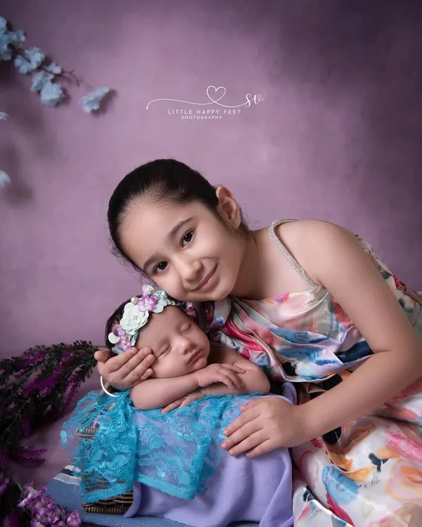 There is nothing sweeter than a big sister's love. Capturing this gentle embrace was a truly special moment, a memory this family will look back on for years to come.