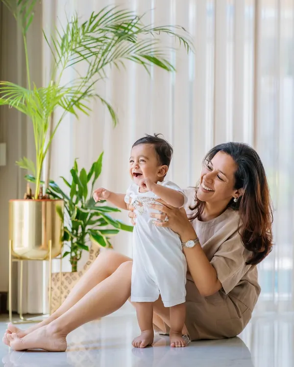 The pure joy on this baby's face says it all! An at-home lifestyle session is perfect for capturing these priceless, natural reactions in a comfortable and familiar environment.