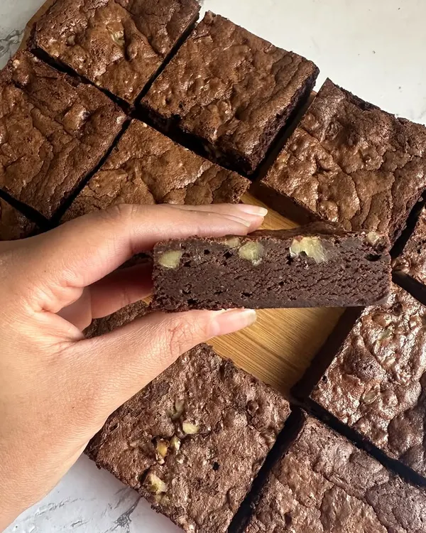Fudgy, rich, and nutty. My Belgian Chocolate Brownies are now available with walnuts for an extra crunchy bite, as you can see in this cross-section.