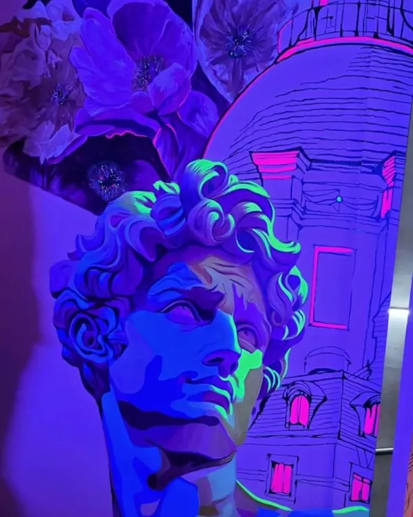 Art that transforms with the light. This mural at 'Raahi' restaurant has a hidden layer of fluorescent paint that comes alive under UV light, creating a surprising and magical experience for evening guests.
