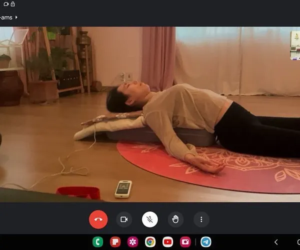 An online private session focusing on posture correction. Even remotely, I can guide you through poses like this supported backbend in Matsyasana (Fish Pose) to help you become more aware of your body's alignment and release tension.