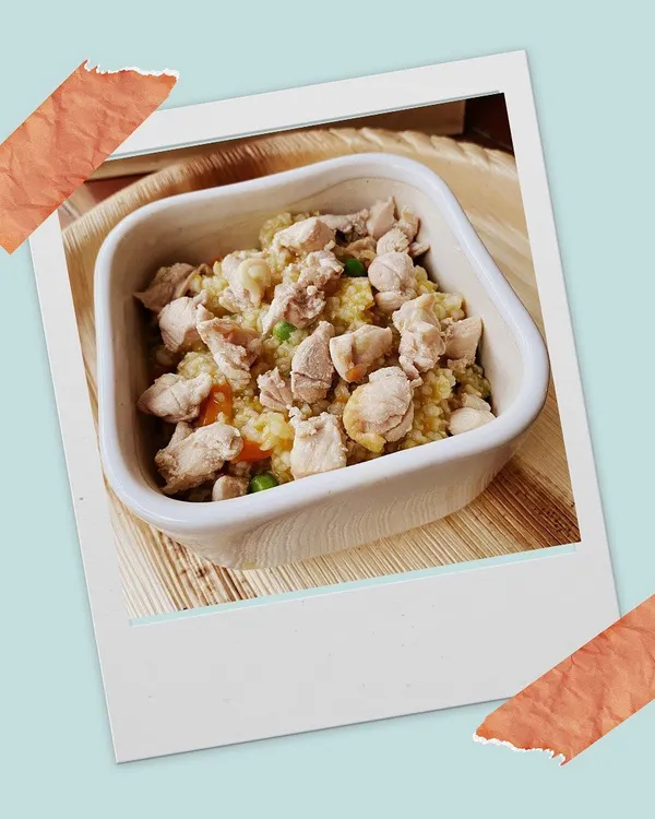 A close-up of my Bow Chicky Bow Chow. It's a simple, wholesome recipe of lean chicken, organ meat, fresh vegetables, and brown rice. I also offer a grain-free option for sensitive tummies.