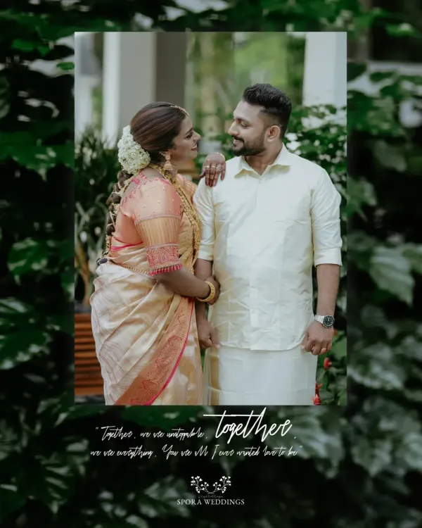 A beautiful South Indian couple sharing a moment of connection. The bride's traditional silk saree and jasmine flowers are perfectly complemented by the groom's simple mundu.