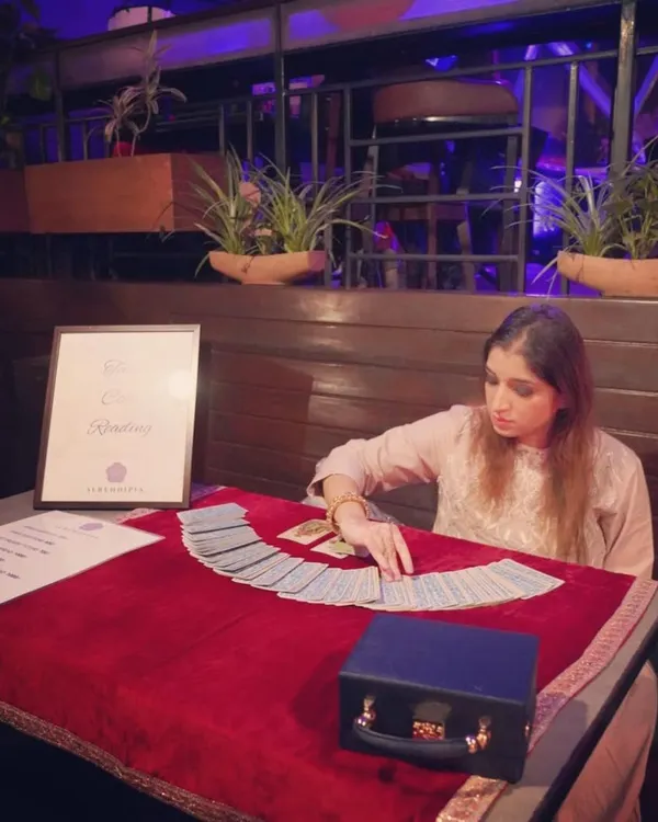 Focused and ready for a client at a Valentine's event. I am available for private events and gatherings, offering a unique and insightful experience for your guests.
