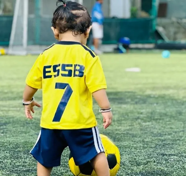 Big dreams start with small kicks. Here, one of our youngest players, just 3 years old, gets familiar with the football. Our toddler program is all about creating a positive first experience with the sport.