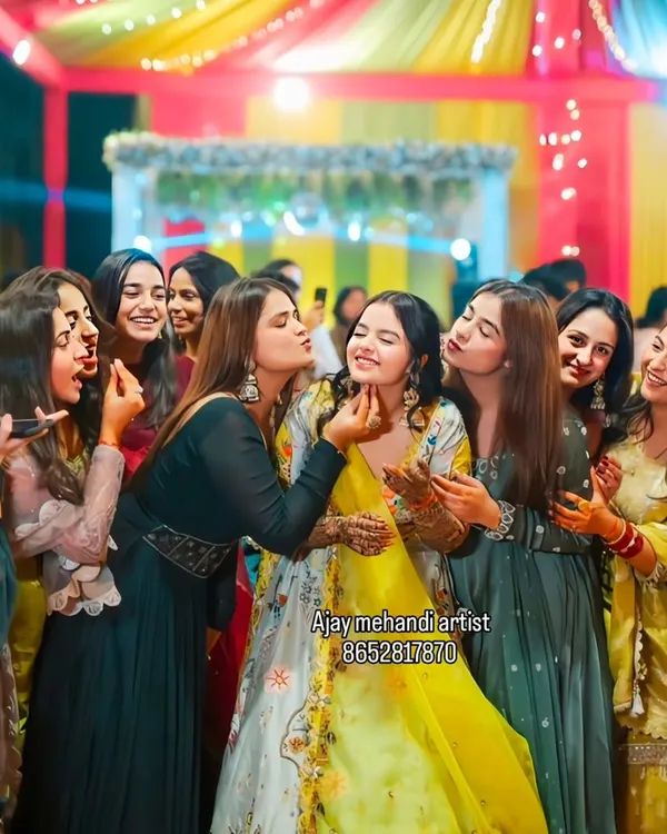 Pure joy at a mehndi function. A bride surrounded by her loved ones is the heart of any wedding celebration, and we are honored to be a part of these moments.