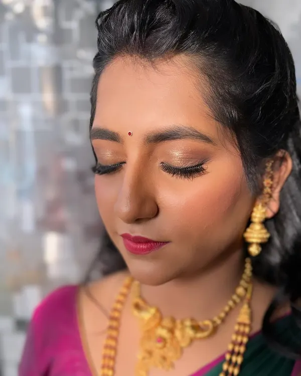 This is a perfect example of a 'no-makeup' makeup look. For her engagement, she wanted something very subtle, so I focused on creating a flawless, glowing base with minimal eye makeup and a natural lip tint.