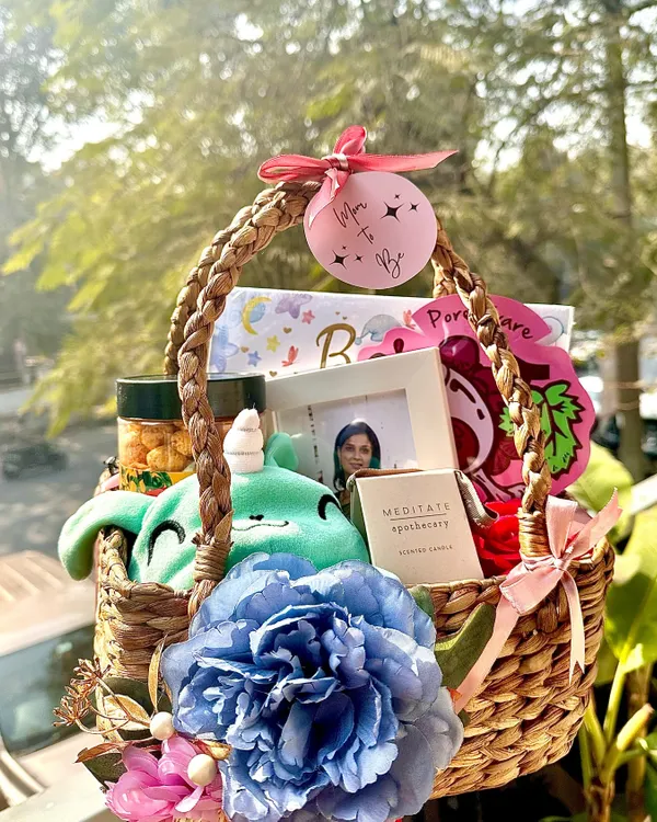 Our most loved "Mom to Be" Basket of Love. This hamper includes a cute soft toy, a baby record book, a soothing scented candle, and a photo frame to capture the special moments.