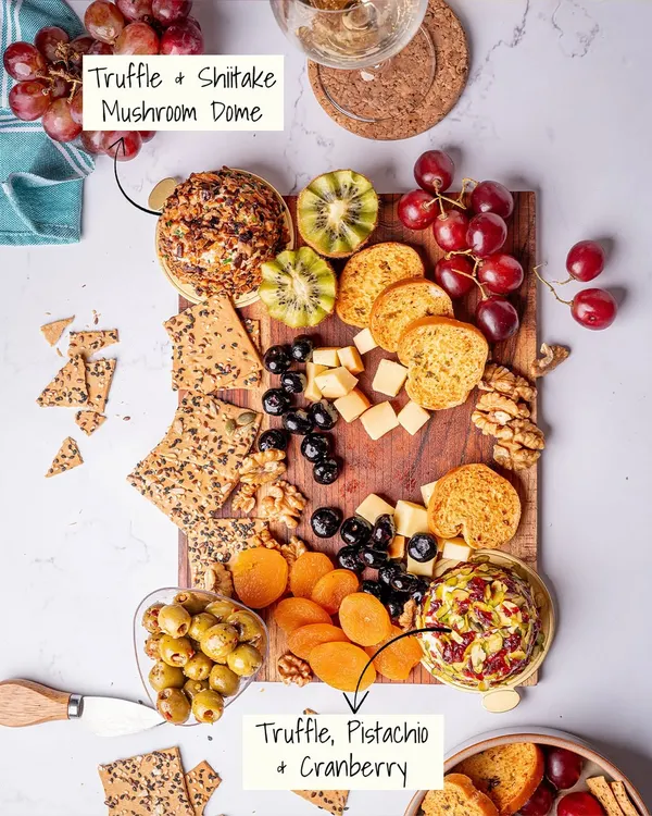 This is what Apero is all about: a beautiful, abundant cheese platter designed for sharing. Notice the variety, from the Truffle, Pistachio & Cranberry dome to the fresh fruits and artisanal crackers, each element is chosen to create a perfect bite.