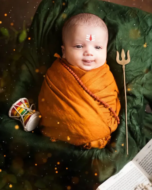 A divine newborn Mahadev, complete with a tripundra on his forehead, a rudraksha necklace, and a tiny trishul. This is one of our most requested spiritual themes.