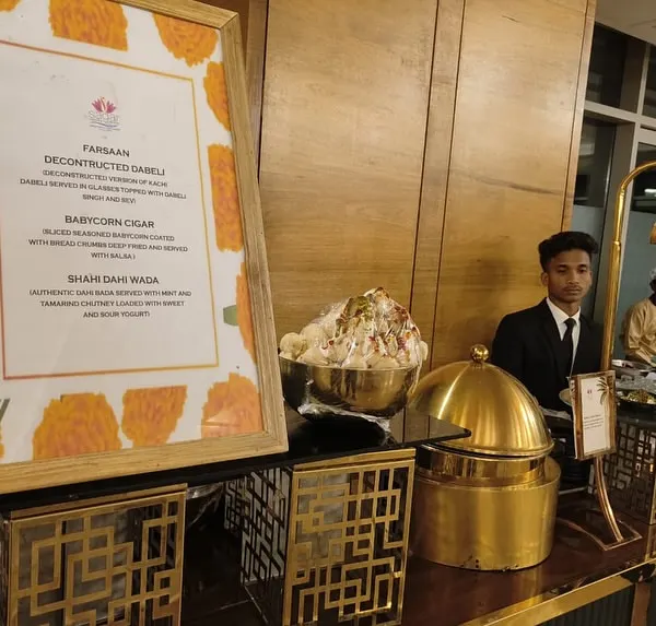 A glimpse of the menu at one of my chaat counters, featuring creative items like 'Deconstructed Dabeli' and 'Babycorn Cigar' alongside classic favorites.