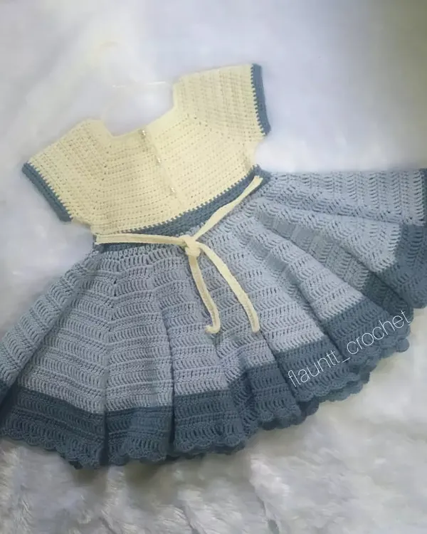 This custom princess frock was made for a little one's second birthday. I used a soft cotton blend yarn to create its full, twirly skirt, which has a flare of over 190 inches. It’s a piece designed for making beautiful memories.