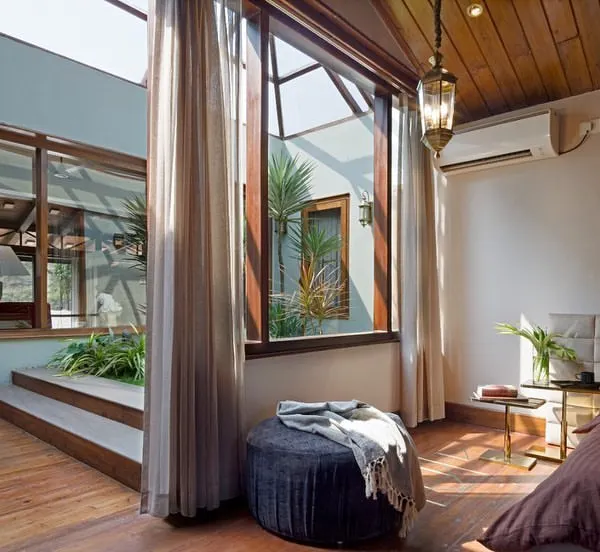 This bedroom in my 'Aangan' project embodies my core belief: creating homes that are in constant dialogue with nature. The space opens up to an internal courtyard, flooding the room with natural light and blurring the lines between the indoors and outdoors, creating a tranquil, biophilic retreat.