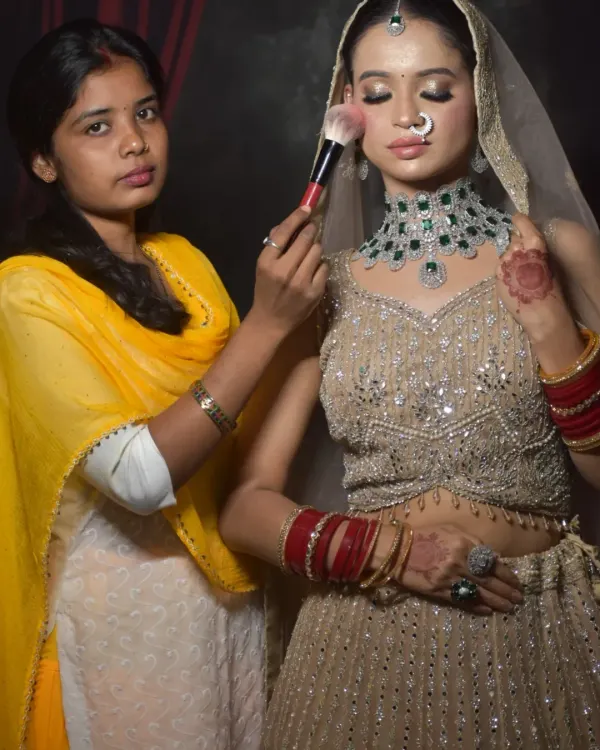 One of my dedicated students practicing her skills during a one-on-one class. She is creating a full bridal look, complete with jewelry and a dupatta, to build her professional portfolio.