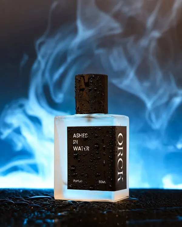 A moody, conceptual shot for a perfume named 'Ashes in Water'. I used smoke and water droplets against a dramatic blue backlight to create an ethereal and mysterious vibe.