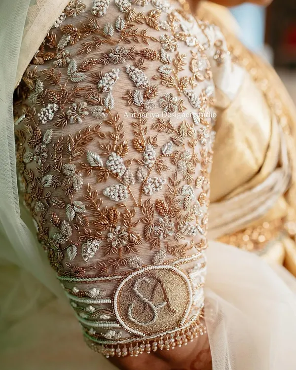 A truly personal touch for the bride. We embroidered her and her partner's initials 'S' and 'A' onto the cuff of her bridal blouse sleeve, making it a beautiful and intimate detail.