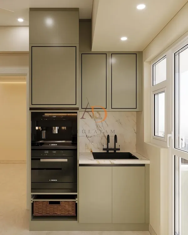 A compact utility or pantry area in a kitchen, featuring an integrated coffee machine, a small sink, and ample cabinet storage.