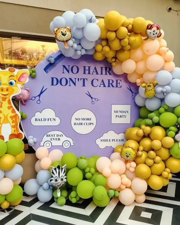This "No Hair Don't Care" backdrop is a client favorite for mundan parties. The fun phrases, cute graphics, and colorful balloon garland make for fantastic photos.