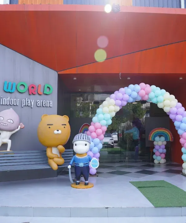 The grand entrance to Wobble World, decorated with a pastel balloon arch for a special event. Our fun character statues welcome you to a world of play from the moment you arrive.