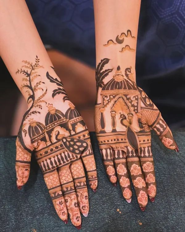 This is a beautiful example of a modern, picturesque mehandi design. It features architectural domes and peacocks, but with more open space than traditional designs, making it perfect for festivals.