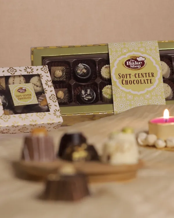 Our Soft-Center Chocolates are a delightful surprise, available in elegant gift boxes. This image showcases the beautiful packaging, perfect for gifting.