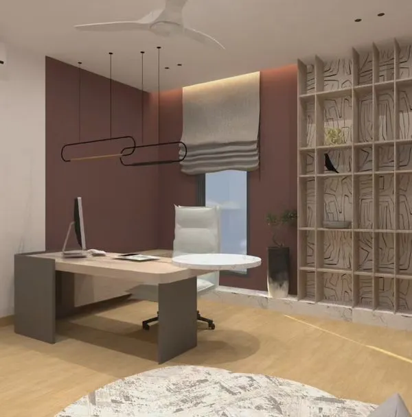 This home office is designed to be both inviting and functional. The custom-designed bookshelf is a piece of art in itself, providing ample storage while creating a unique visual feature. The warm accent wall and modern lighting make it a great space for focused work.
