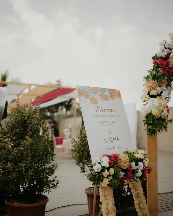 The welcome sign that greets your guests, adorned with flowers, setting the tone for the celebration to come.