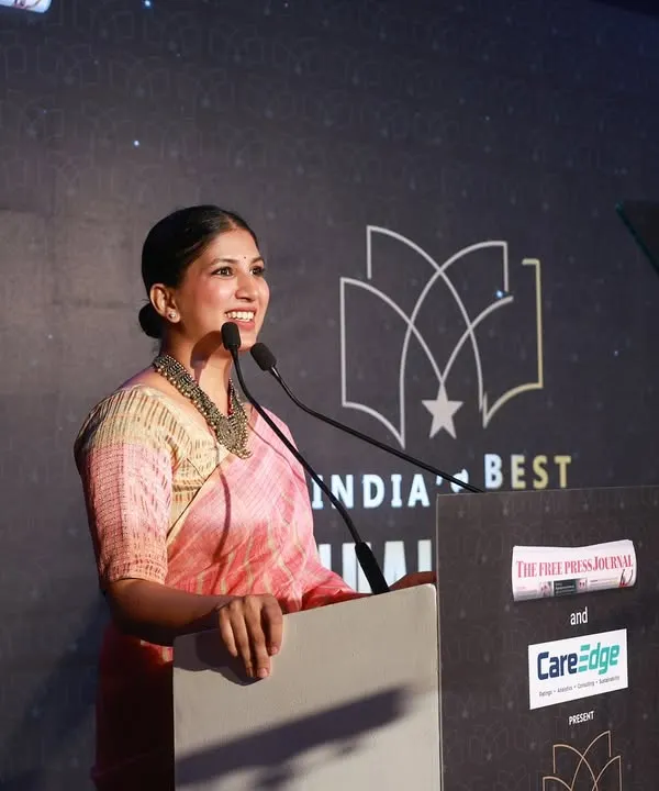 A smile of confidence while hosting India's Best Annual Report Awards. I ensure the script is delivered with clarity and warmth, keeping the evening's proceedings running smoothly for all the esteemed guests.