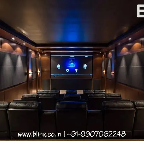 We designed this dedicated home cinema to be a perfect escape. The multi-level seating with plush leather recliners ensures every viewer has an optimal line of sight to the large projection screen, while the professionally calibrated lighting and acoustic panels create a truly immersive atmosphere.