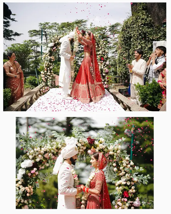 The Varmala ceremony, a moment of joy and mutual respect. I capture this from multiple angles, showing both the wide view of the celebration and the intimate close-up of the couple.