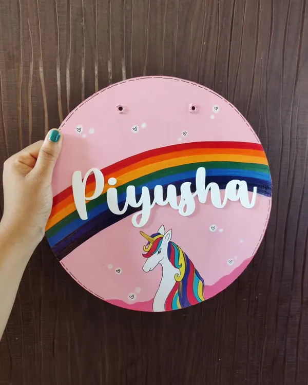 This custom unicorn-themed nameplate is a perfect example of how I bring imagination to life. I hand-paint each piece with care, using vibrant colors and 3D acrylic lettering to create a magical addition to any kid's room.